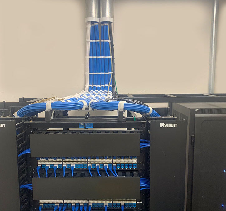 Structured cabling installation with Category 6 and fiber optic cabling in MDF buildout.